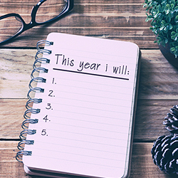 New Years Resolutions checklist in notebook.