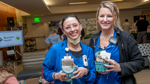 Two Baystate Health employees posed with their goodie bags