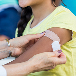 an adolescent getting an HPV vaccine