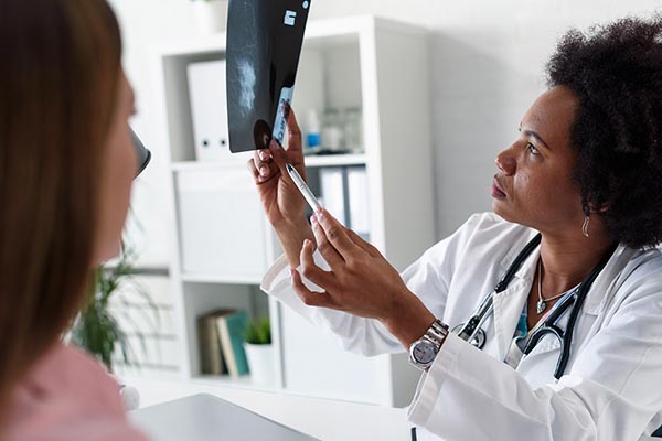 a woman consulting with her doctor on breast cancer surgery options