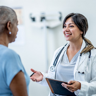 a breast cancer survivor seeing her healthcare provider for a checkup