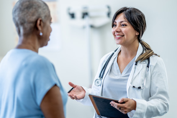 a breast cancer survivor seeing her healthcare provider for a checkup