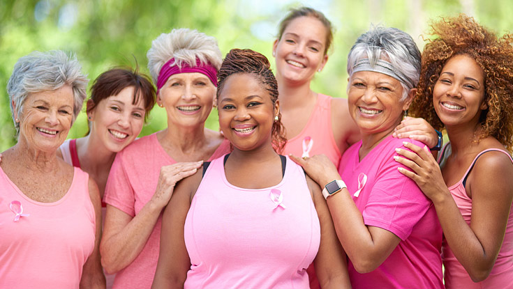 A group of women wearing pink for breast cancer awareness