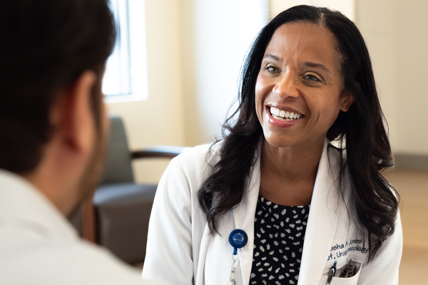 a smiling doctor in a white coat