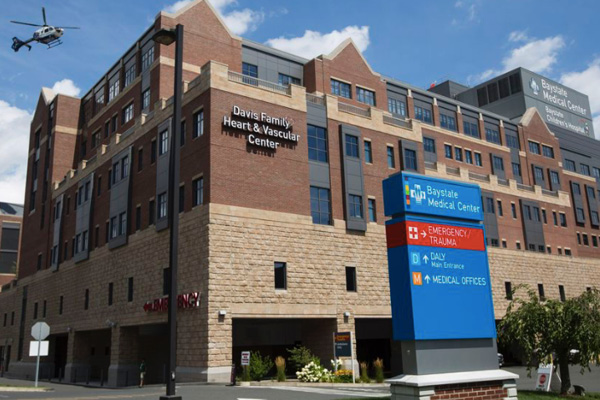 exterior photo of baystate medical center's emergency department with a helicopter in the air