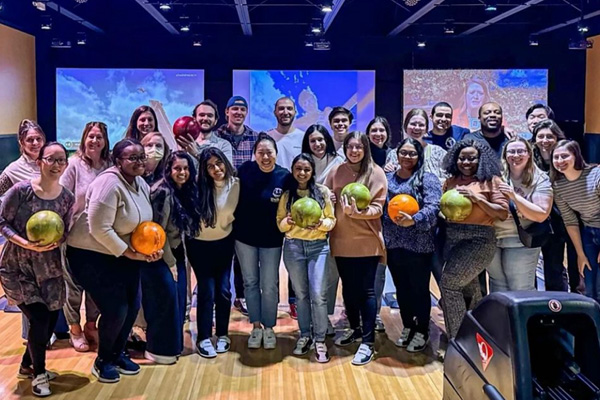 a large group of internal medicine residents at a bowling alley