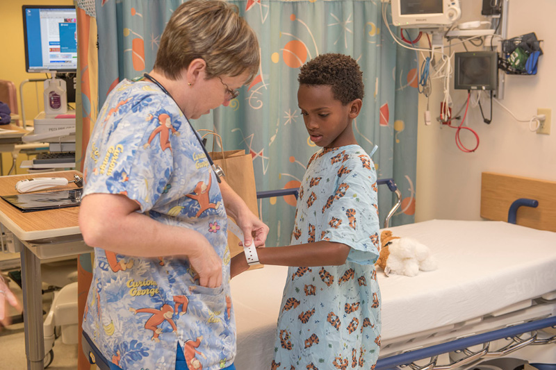 nurse with a pediatric patient