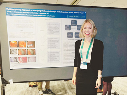 consultation-liaison fellow in front of a presentation