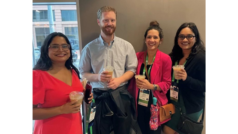 Associate Program Director Deepika Sundararaj and residents take a coffee break between conference sessions. 