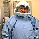 ID fellow in Ebola suit
