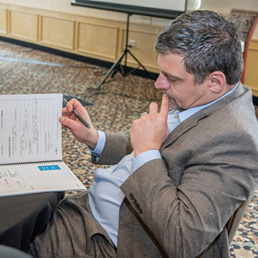 physician looking over some paperwork