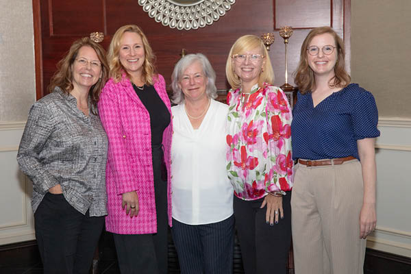 five women at the bwims impact award ceremony
