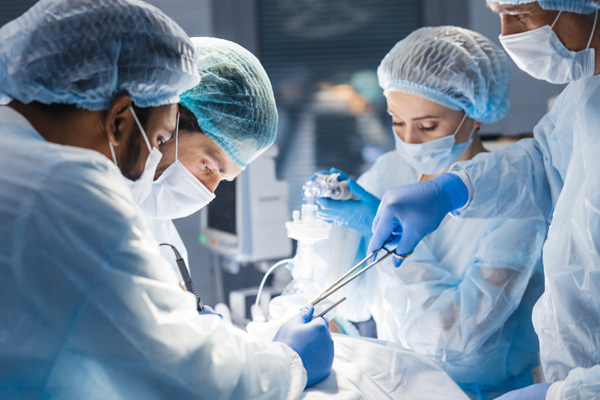 diverse team of surgeons and nurses operating on a patient