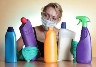 Woman with cleaning supplies