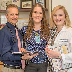 Internal Medicine Intern Anna Clarke MD with her sister, pediatrics resident Rachel Clarke, and Dr. Rosenblum