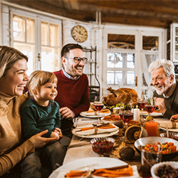Family talking over thanksgiving dinner