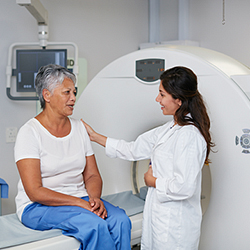 a woman discussing pancreatic cysts with her doctor, waiting for an MRI scan