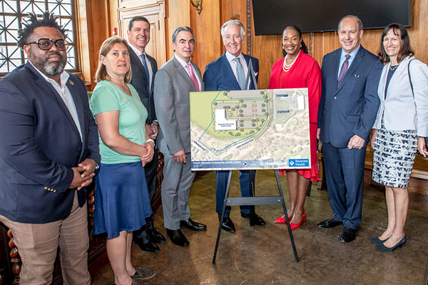 Baystate, MassMutual, and city leaders pose with map
