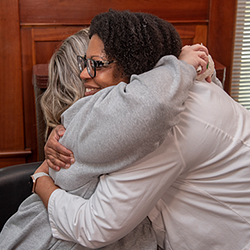 Julie Merritt and Dr. Tashanna Myers hugging