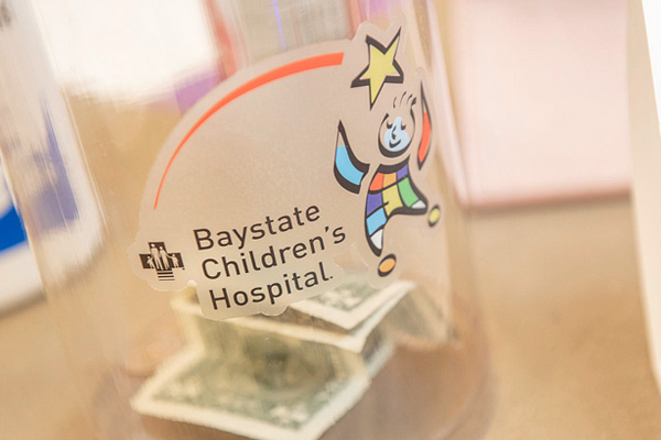 a donation jar with the baystate children's hospital logo on it