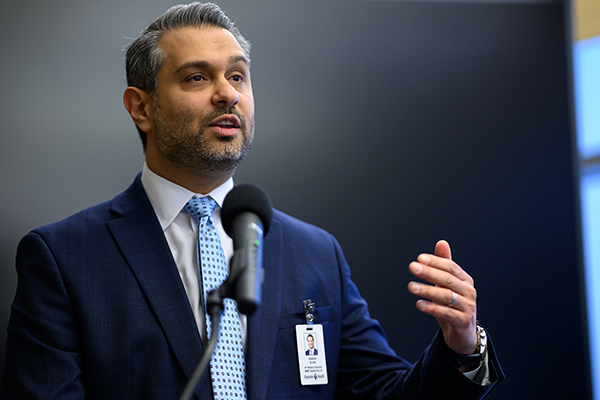 Dr. Rawad Elias speaking into a microphone.