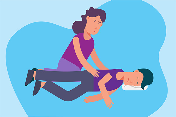 first aid: ease the person to the floor, turn them on their side, support their head