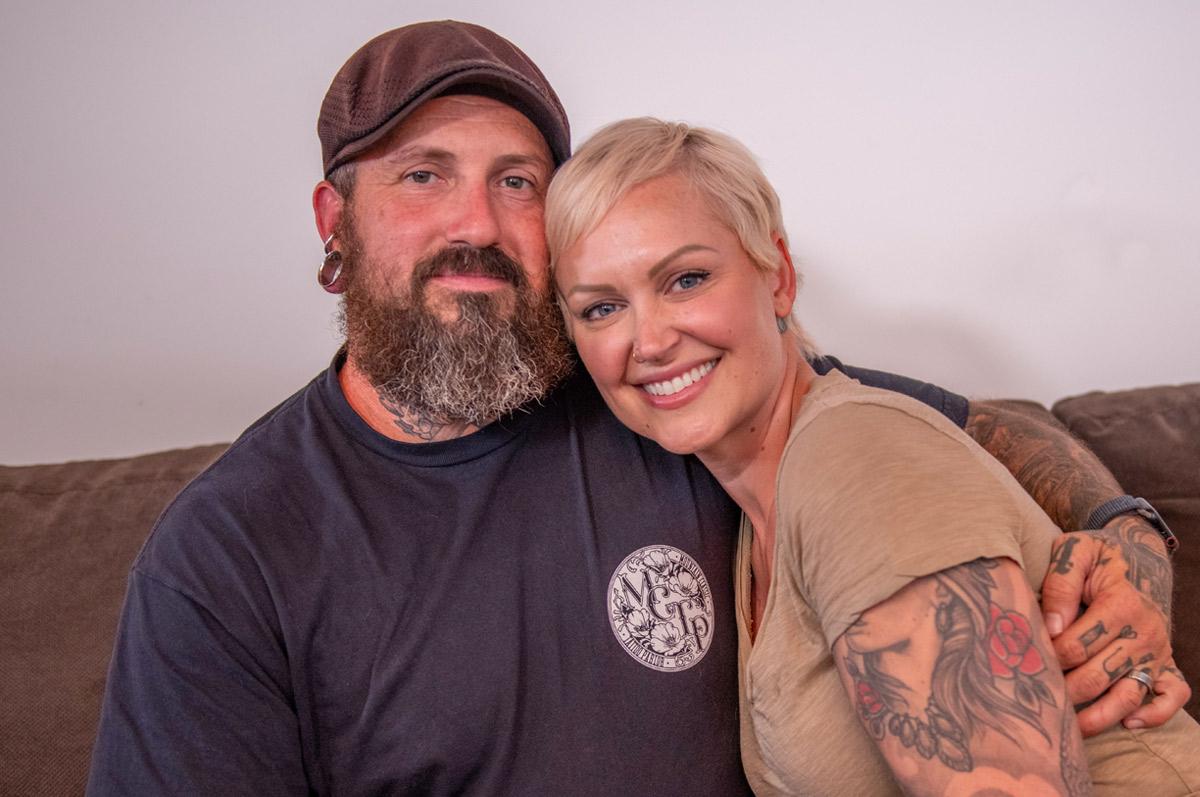 Jenn Venn smiling for a photo with her huband