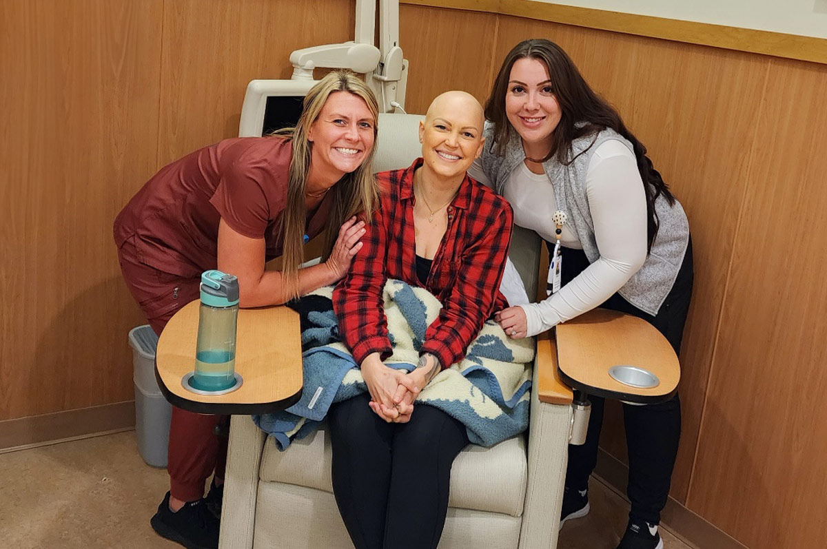 Jenn posing with the Infusion Suite nurses, Laura Curtis and Amelia Anderson