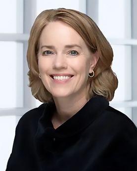 a woman with shoulder-length blonde hair wearing a dark shirt and smiling for the camera