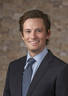 Formal portrait of a smiling Luke Allen