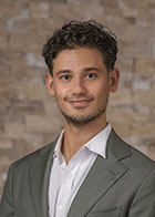 Formal portrait of a smiling Dr Stefan Boas