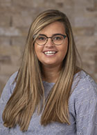 Formal portrait of a smiling Dr Jennifer Nordbye