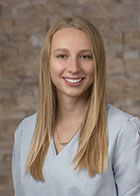 Formal portrait of a smiling Dr Rachel Truland