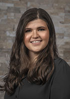 Formal smiling portrait of Dr Kayley Siemiatkoski