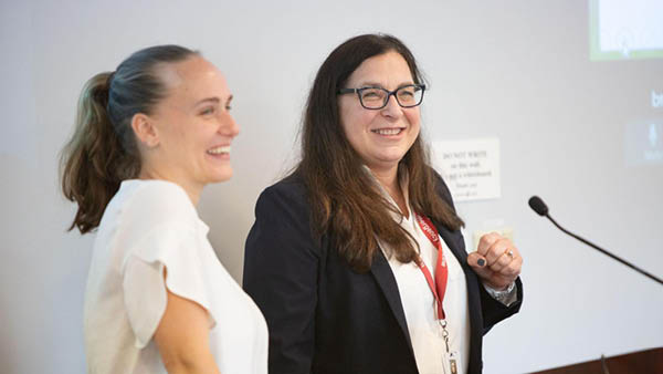 two nurse scientists at a podium giving a presentation