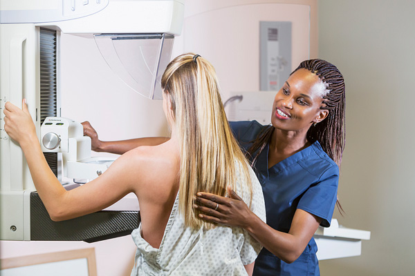 Woman getting mammogram