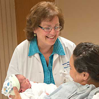 Midwife Susan DeJoy with Mother and Newborn