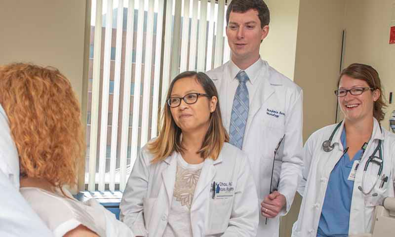 neuro sciences dr barnes around a patient in the hospital