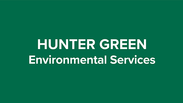 hunter green colored uniform representing environmental services